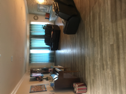 Spacious living room for relaxing to watch a movie, listen to our player piano music, do fun engaging activities, and have room to visit with family and friends. Large windows to bring in natural sunlight.